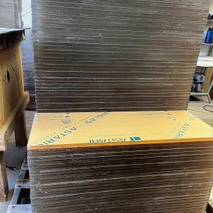 stack of 1/2 inch clear acrylic sheets cut into square blanks ready for fabrication